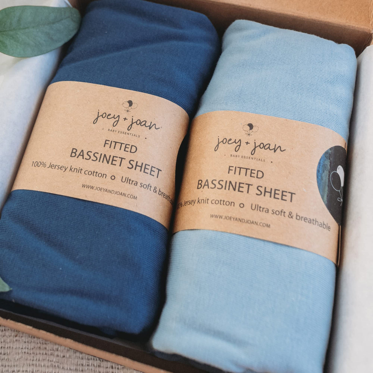Joey + Joan two-pack bedside sleeper sheets in dusty blue and navy for quick changes