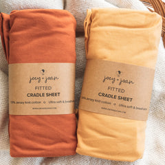 Joey + Joan cradle sheets 18x36 close-up reveals soft jersey fabric for gentle baby comfort.