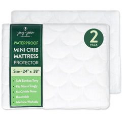 Joey + Joan mini crib protector with snug elastic fit ensures secure sleep.