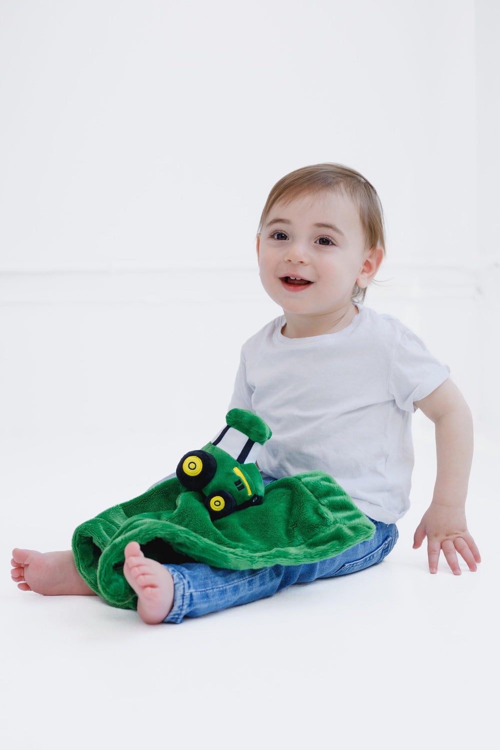 John Deere plush toy tractor detail provides soothing security during nap time
