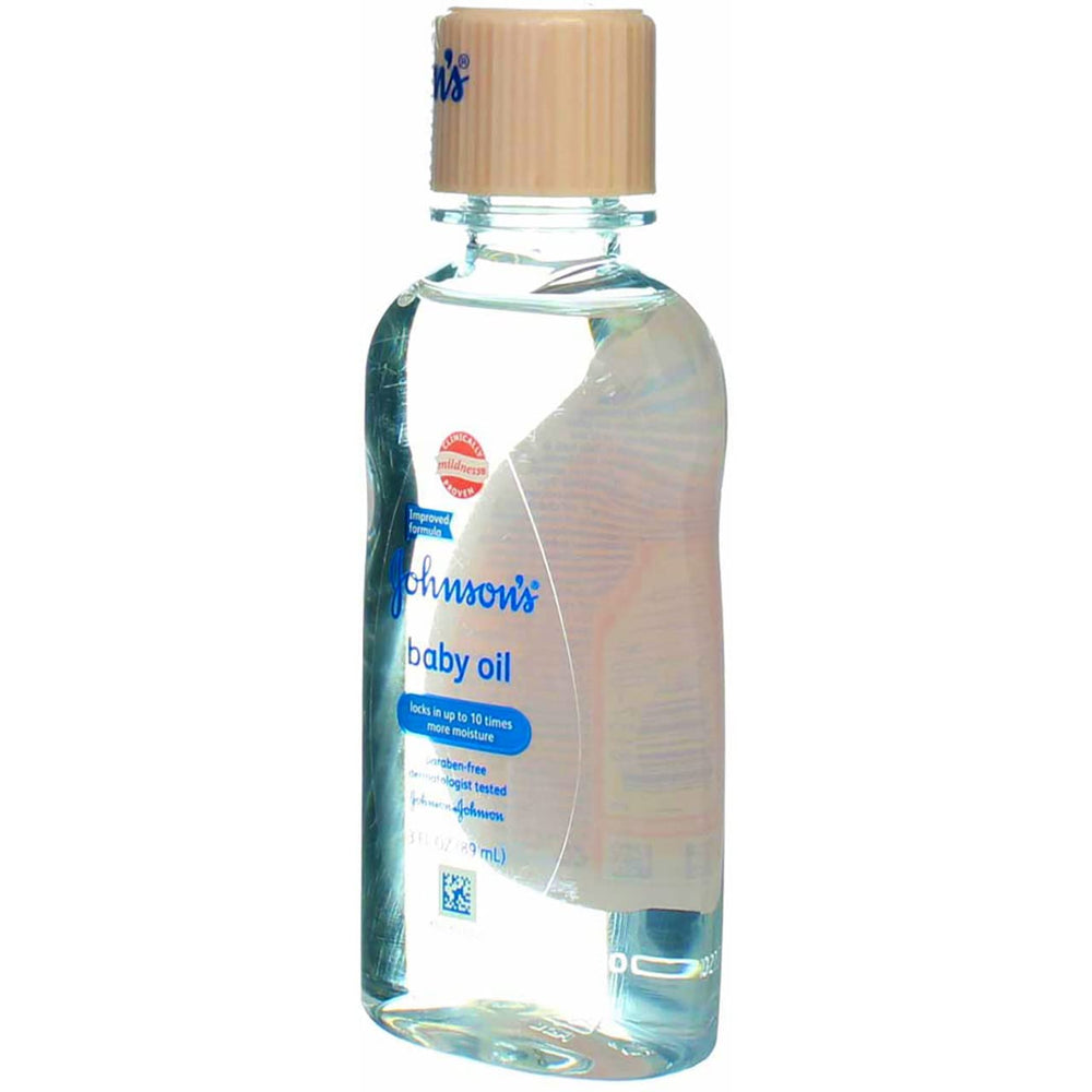 Johnson & Johnson Baby Oil close-up emphasizes silky texture on delicate skin.