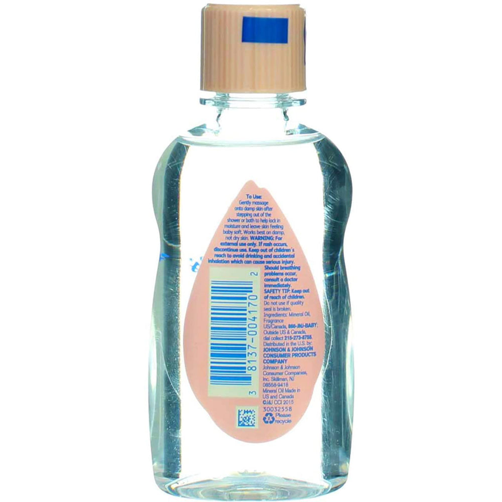 Johnson & Johnson Baby Oil during infant massage demonstrates soothing skincare routine.