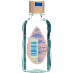 Johnson & Johnson Baby Oil during infant massage demonstrates soothing skincare routine.