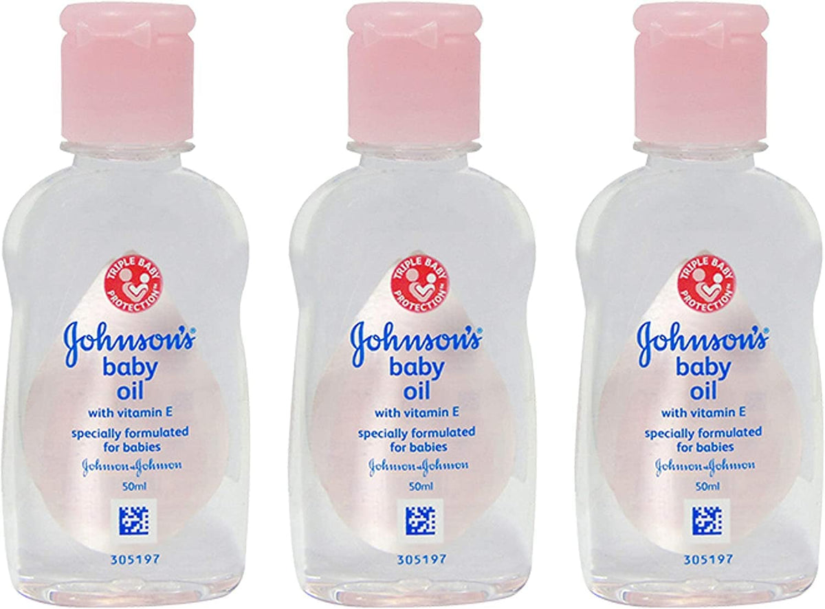 Johnson's Baby Massage Oil 50ml bottle pour for gentle baby massage routines.