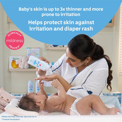 Johnson's Baby Powder being applied to skin after bath for a soft, dry feel.