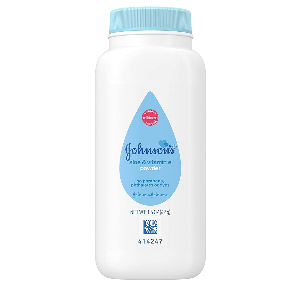 Johnson's Baby Powder trial-size bottle closeup emphasizing moisture absorption on the go