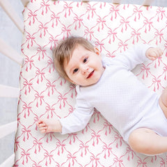 Jola's House bow crib sheets close-up fabric feels breathable and gentle on skin.