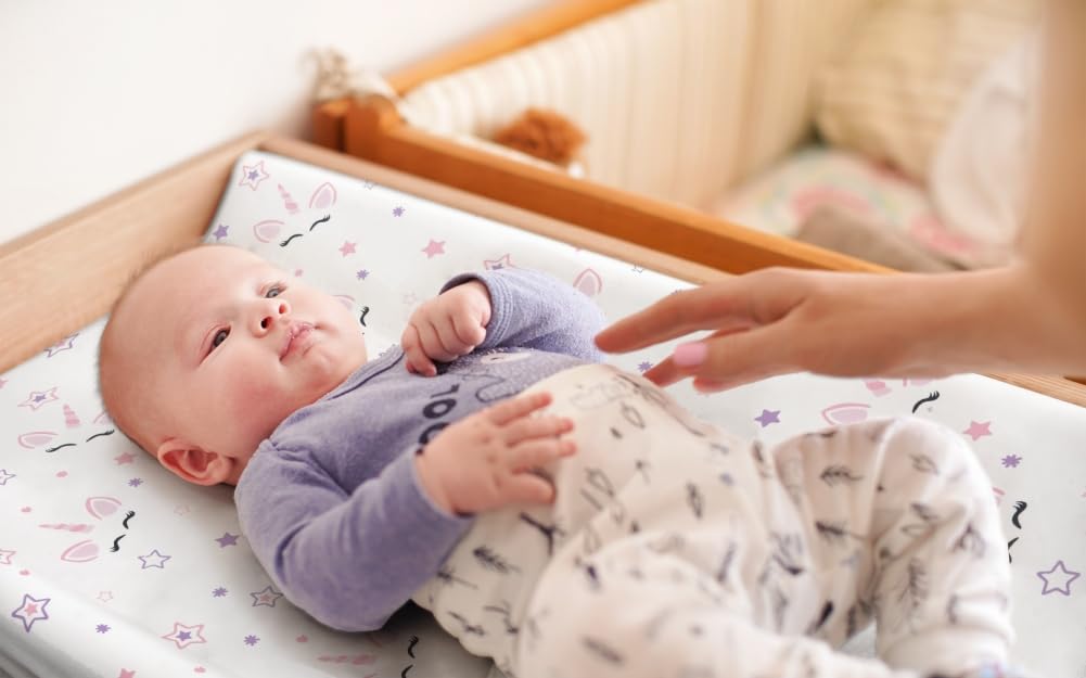 Jola's House fitted changing pad cover with elastic edges stays secure.