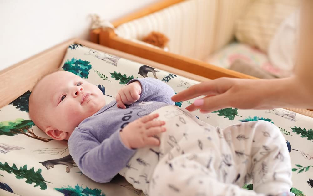 Jola's House woodland design changing pad cover pattern enhances nursery aesthetics and easy care.