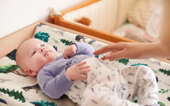 Jola's House woodland design changing pad cover pattern enhances nursery aesthetics and easy care.