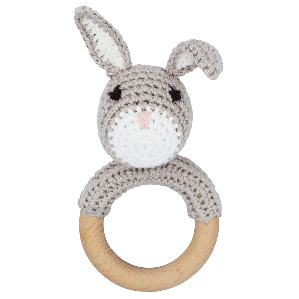 Joliecraft natural wooden baby rattle showing handcrafted stitches and safe teether ring