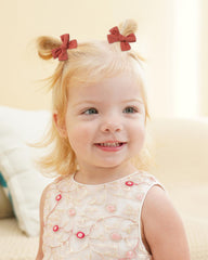 Jollybows 2-inch baby bow collection demonstrates versatile styling for bangs and ponytails.