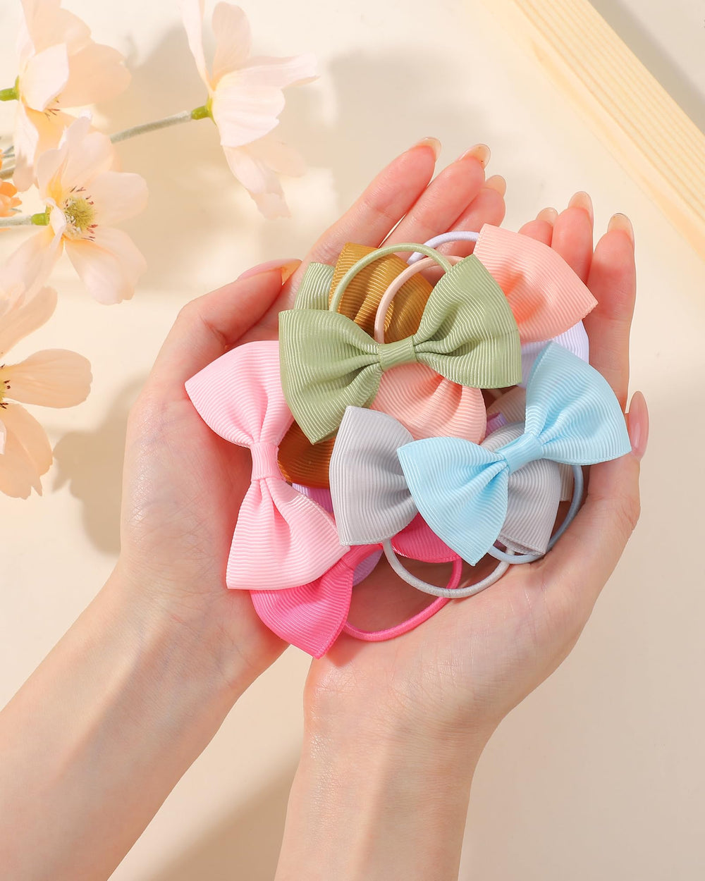 Jollybows 40-piece pack offers assorted colors for mix-and-match outfits.