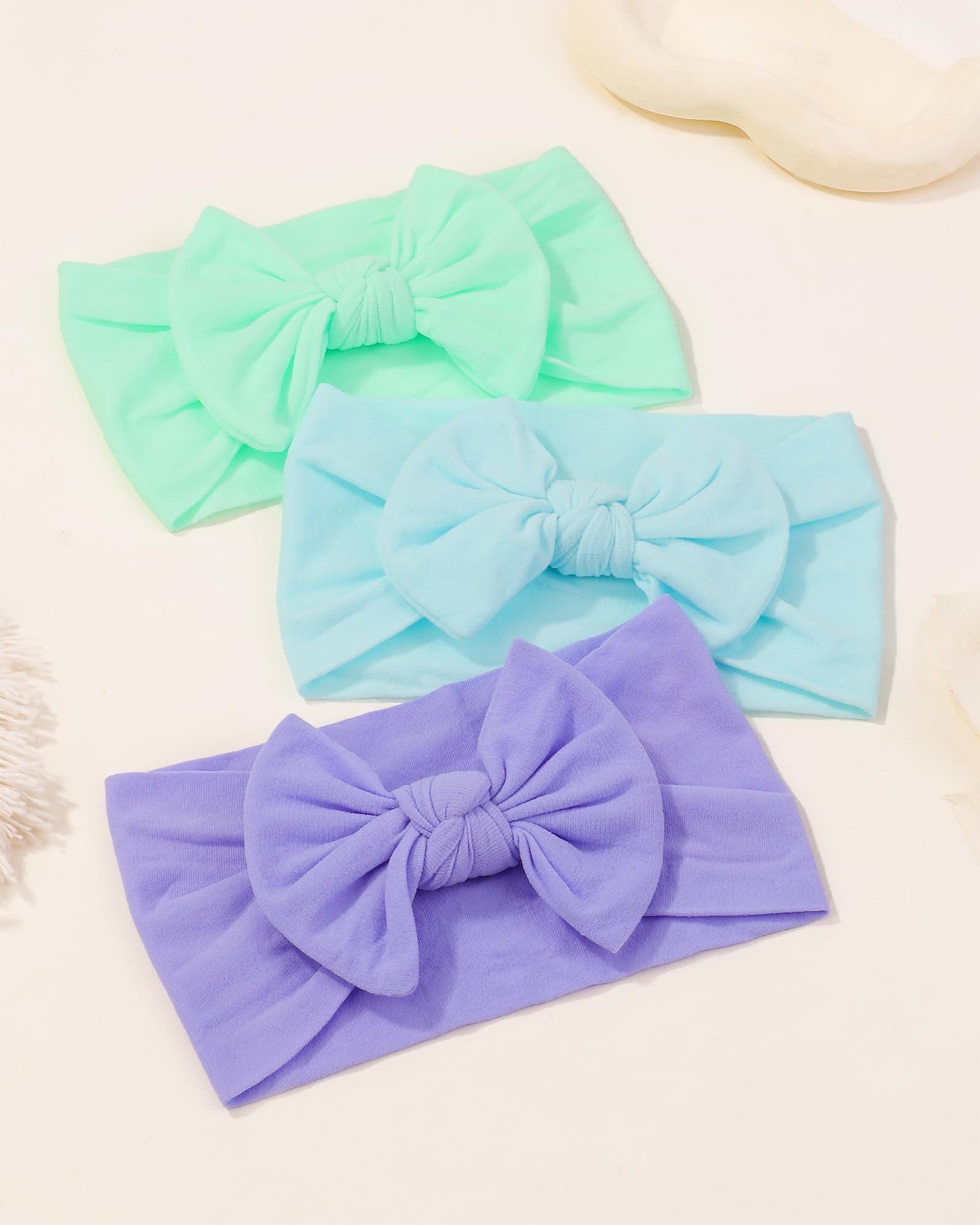 jollybows 9-pack headbands arranged for easy matching with outfits.