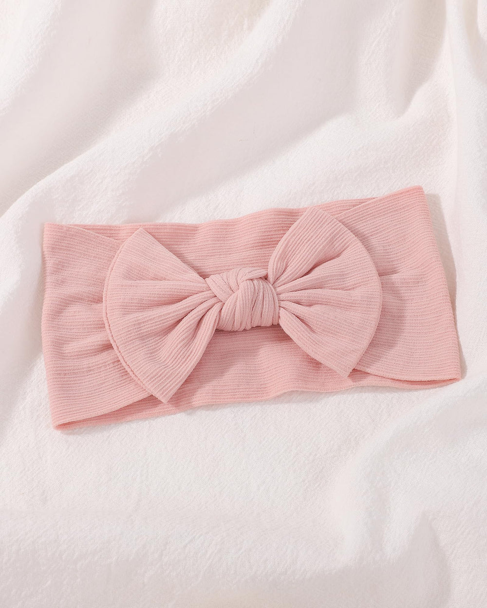 Jollybows adjustable fit headbands easily position for comfortable wear.