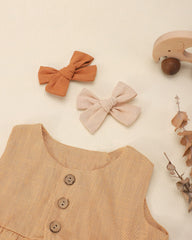 Jollybows baby hair clip close up demonstrates secure full lined clip for lasting hold.