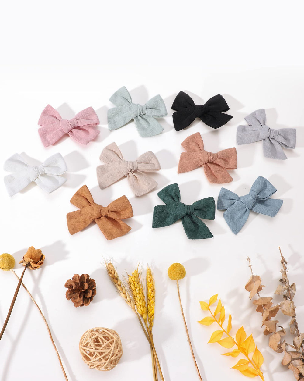 Jollybows baby shower gift scene shows versatile bow set for newborns and toddlers.