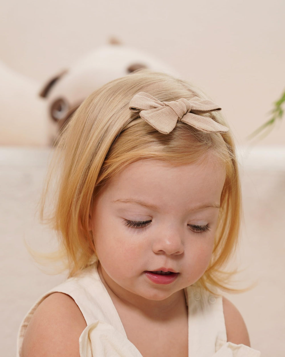 Jollybows bows on baby hair demonstrating comfortable elastic fit.