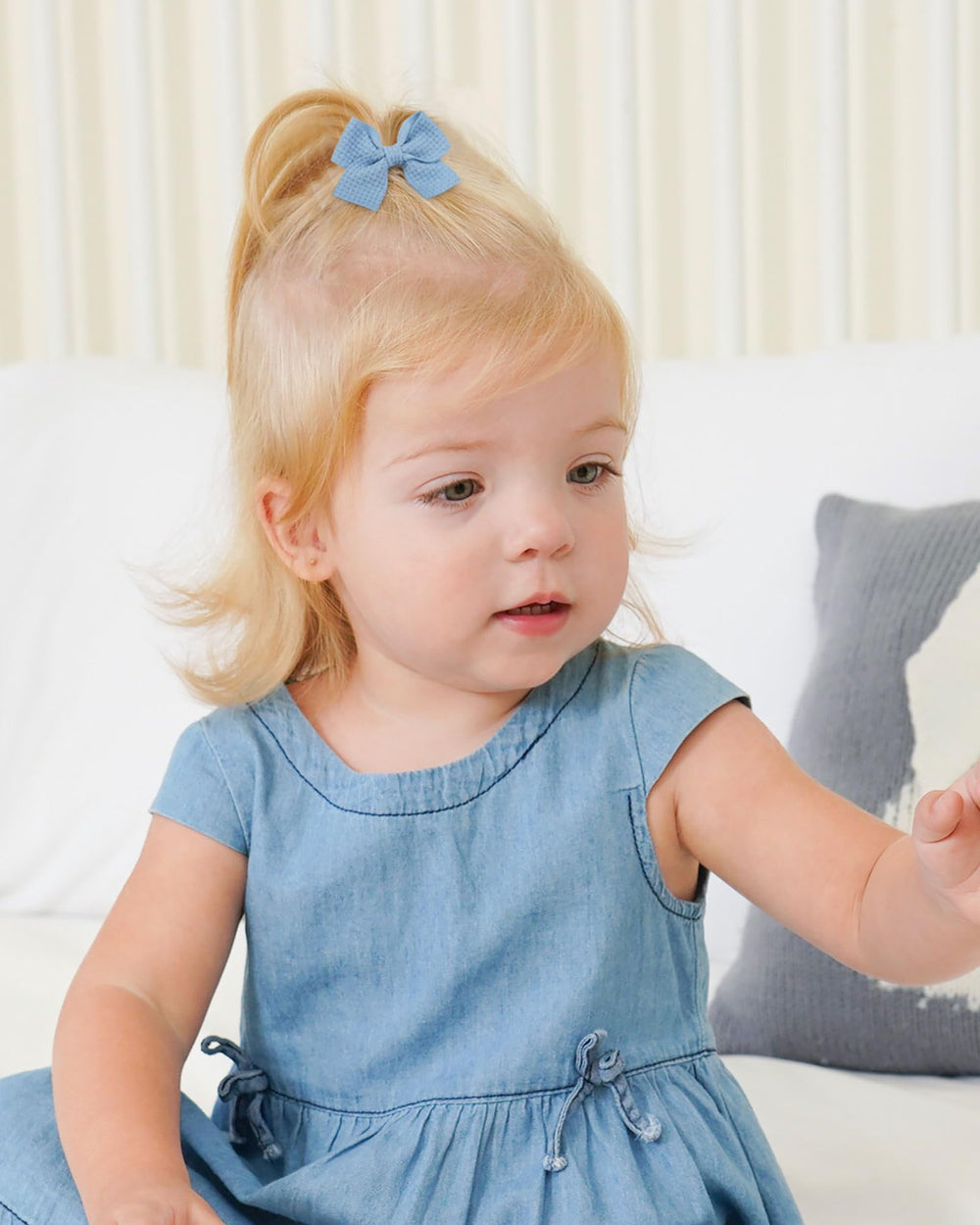 Jollybows mini bow 2in cream adds subtle shine to toddler hairstyles.