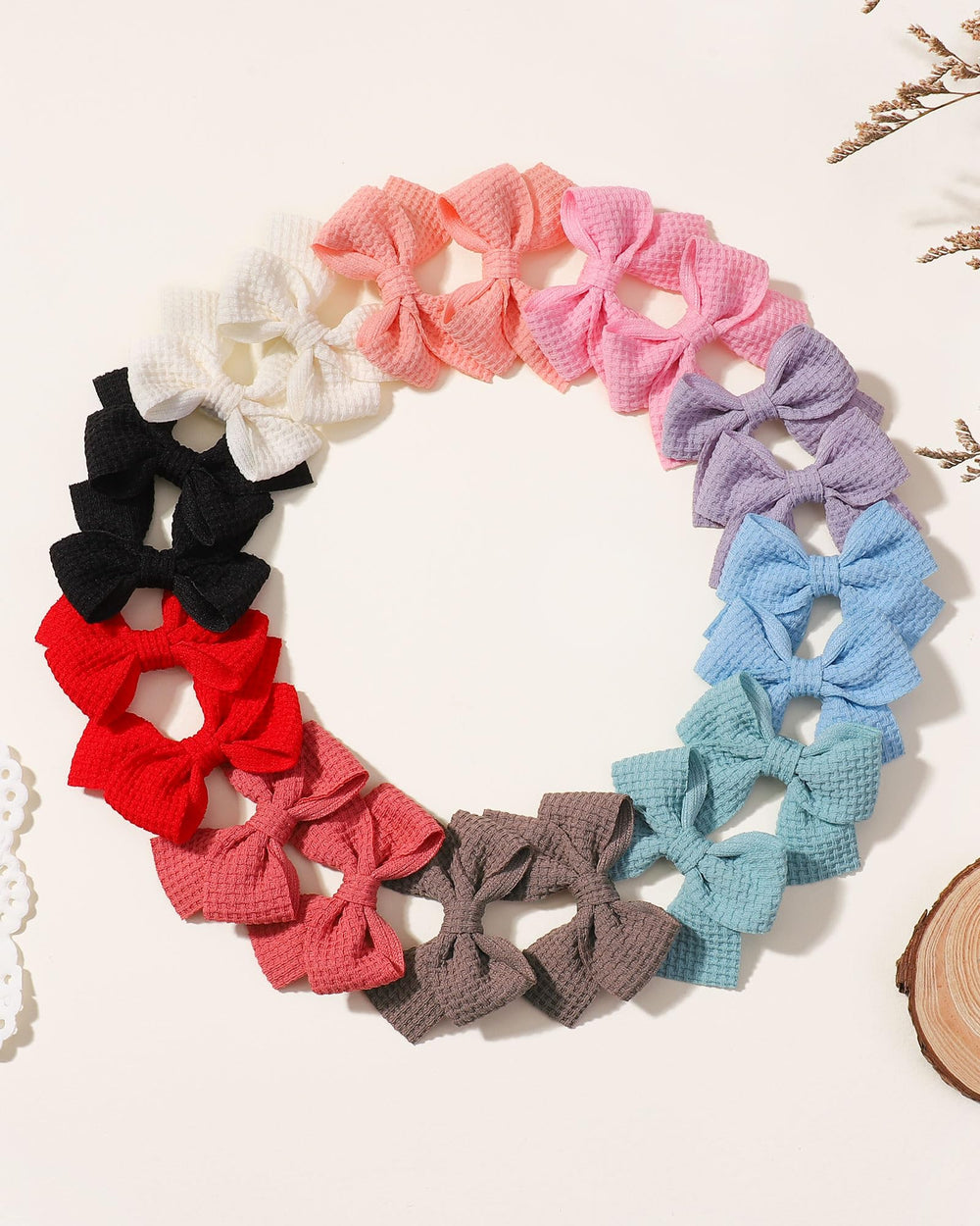 Jollybows mini bow 2in soft blue provides cute contrast to outfits.