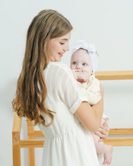 Jollybows newborn nylon headband stretches for comfortable all-day wear.