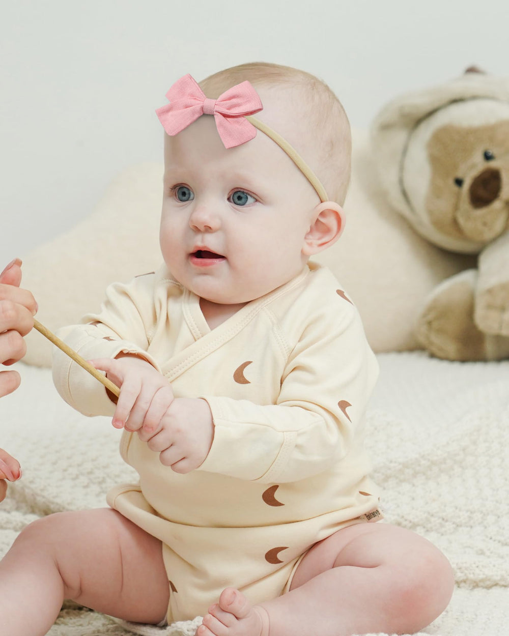 Jollybows nude nylon headband worn for gentle, irritation-free wear
