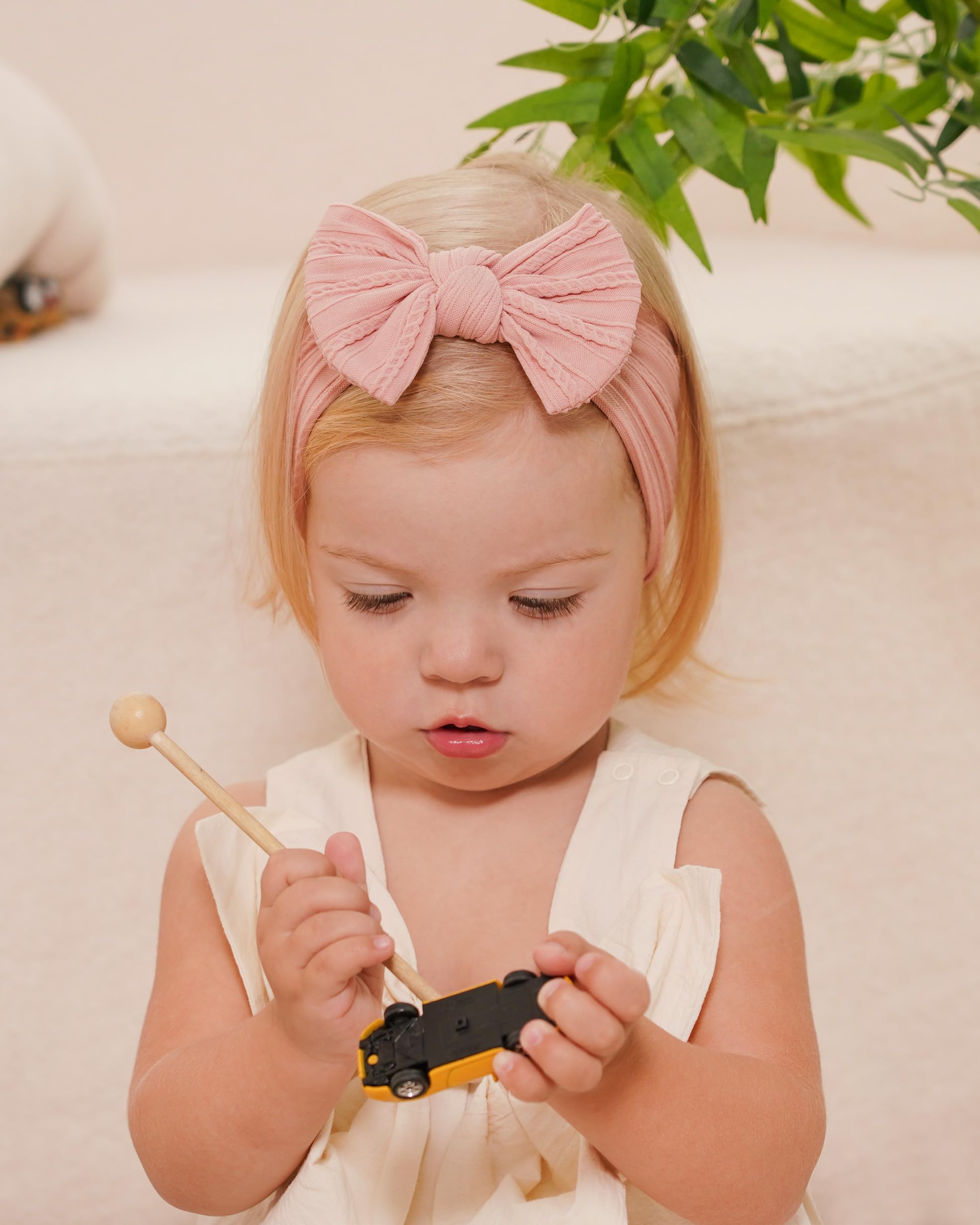 Jollybows nylon stretch headband demonstrates comfortable, gentle fit for delicate baby skin.