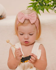 Jollybows nylon stretch headband demonstrates comfortable, gentle fit for delicate baby skin.