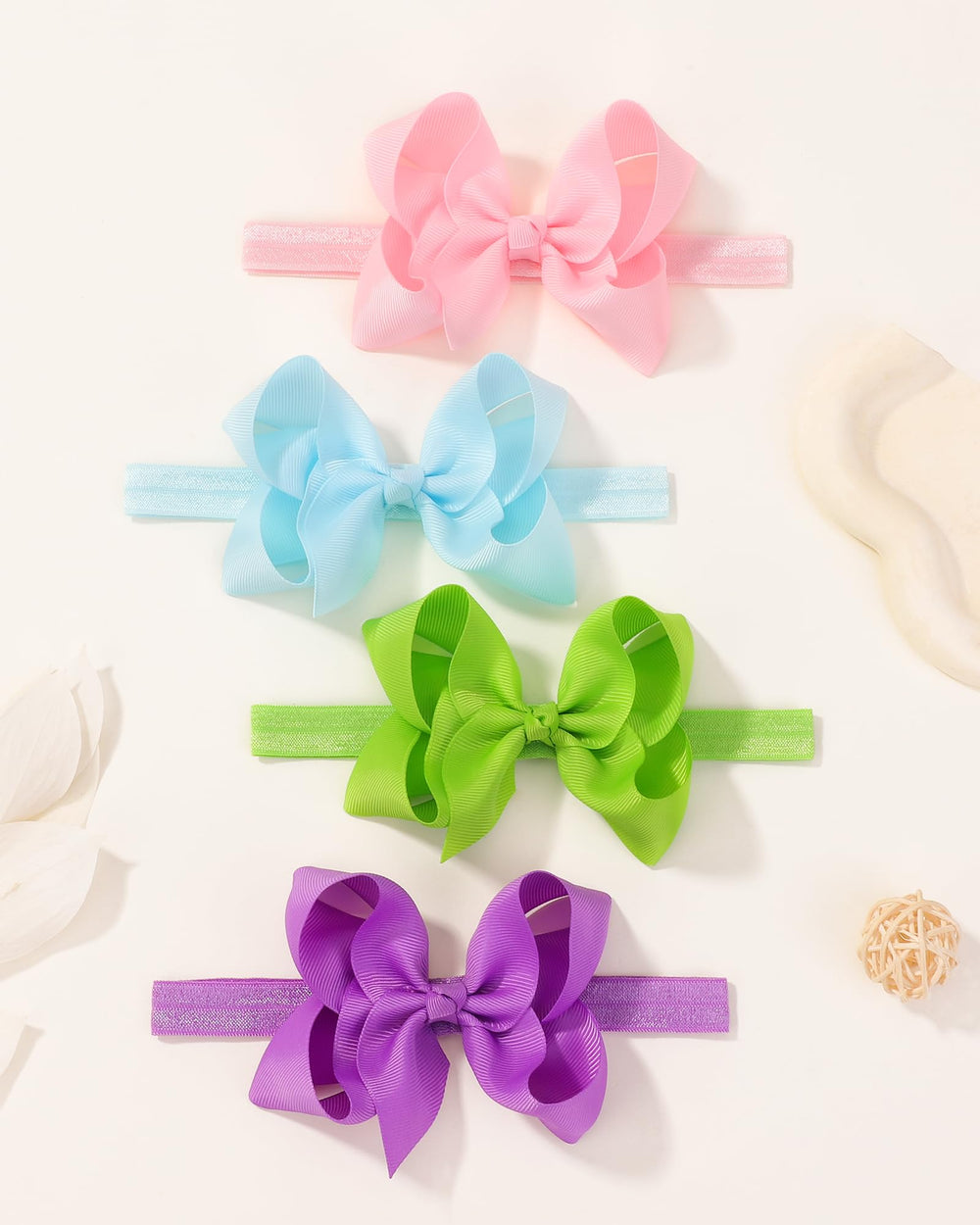Jollybows photoshoot-ready bows in natural colors to enhance baby outfits.