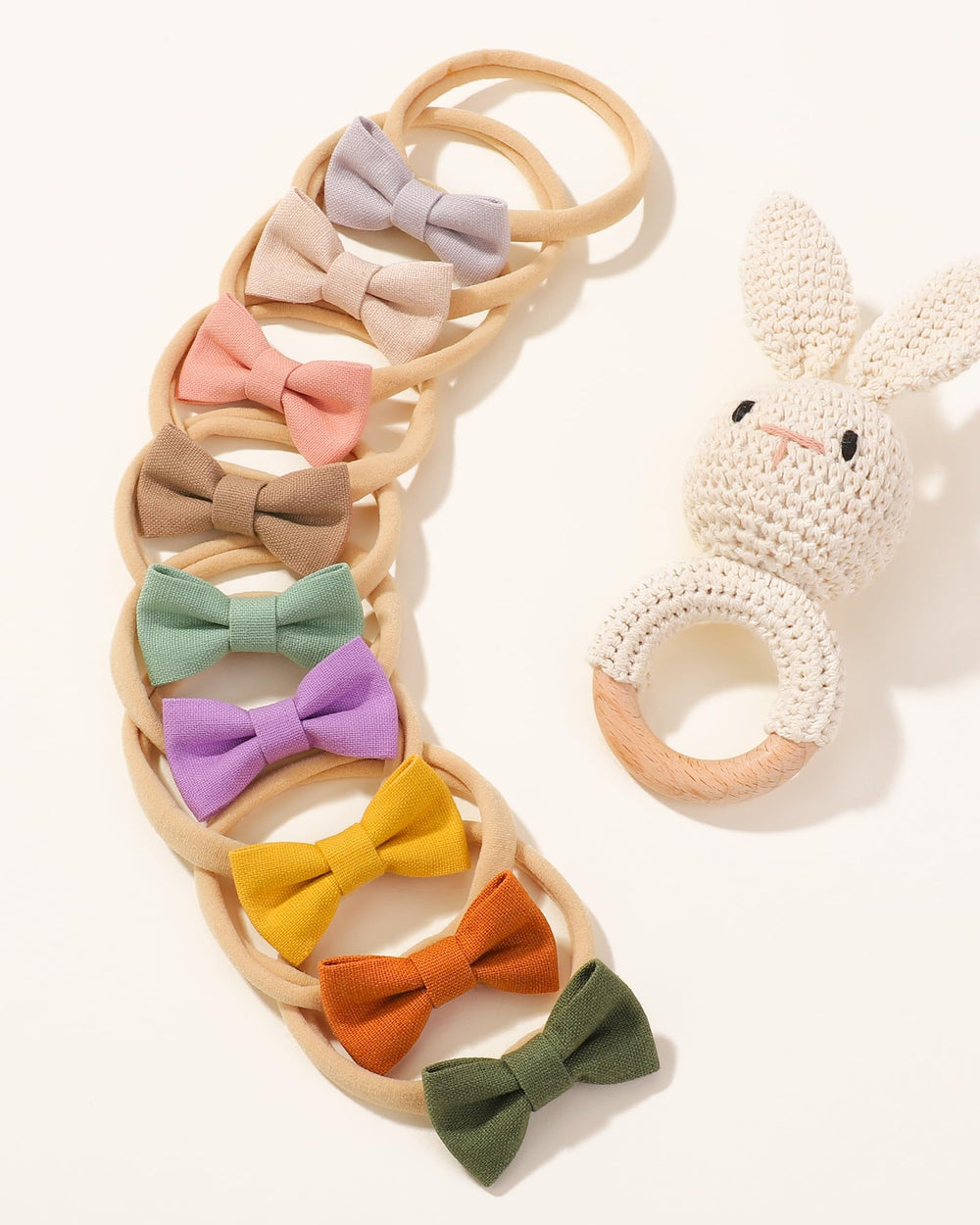 Jollybows stretchy headband adapts to growing baby heads for longer wear.