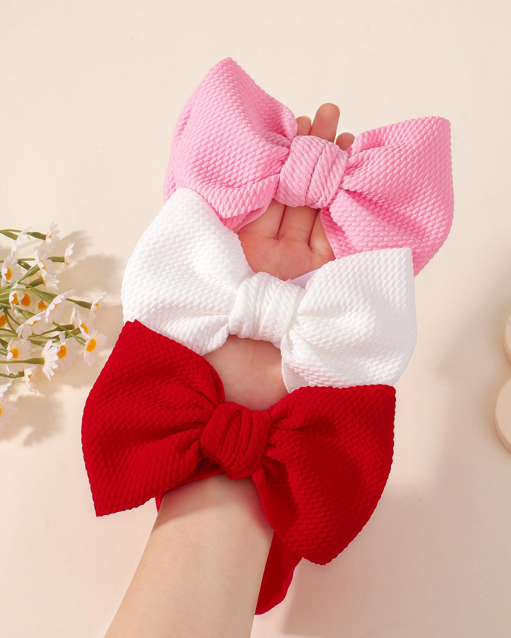 Jollybows stretchy headband-fit adapts from newborn to toddler sizes.