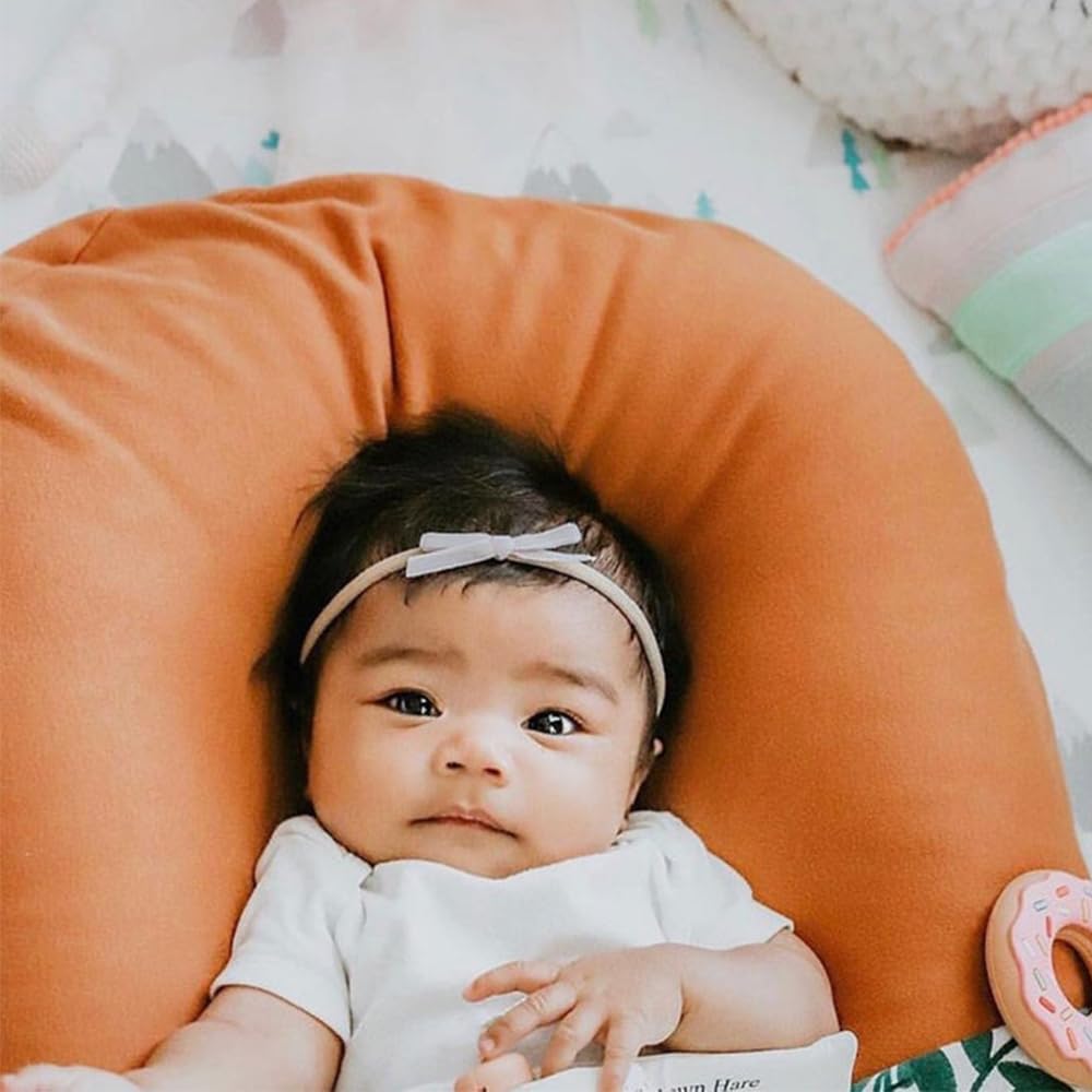 Jomila infant-to-toddler fit demonstrates flexible sizing for growing children.
