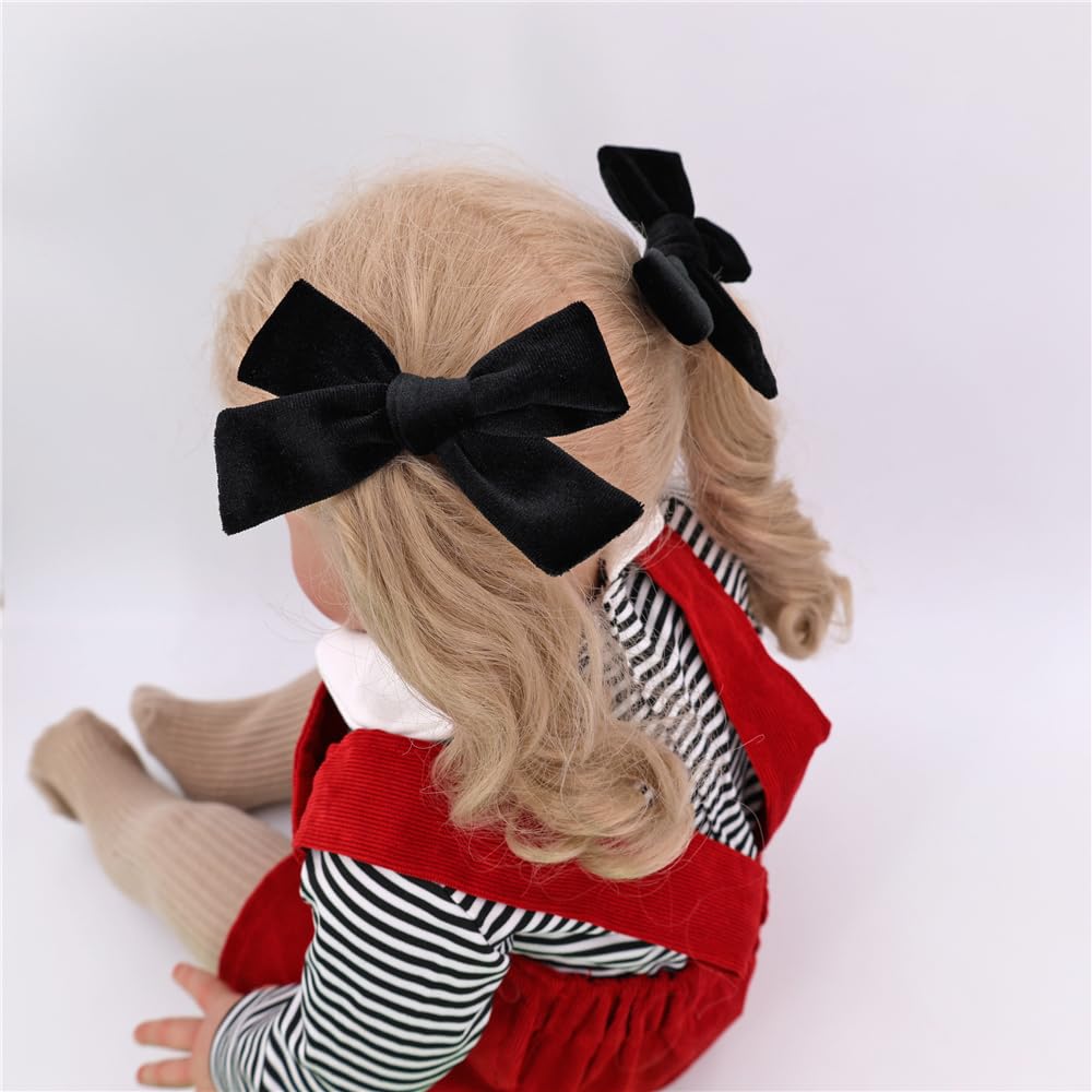 Jomila velvet bow hair clip worn on toddler for everyday charm.