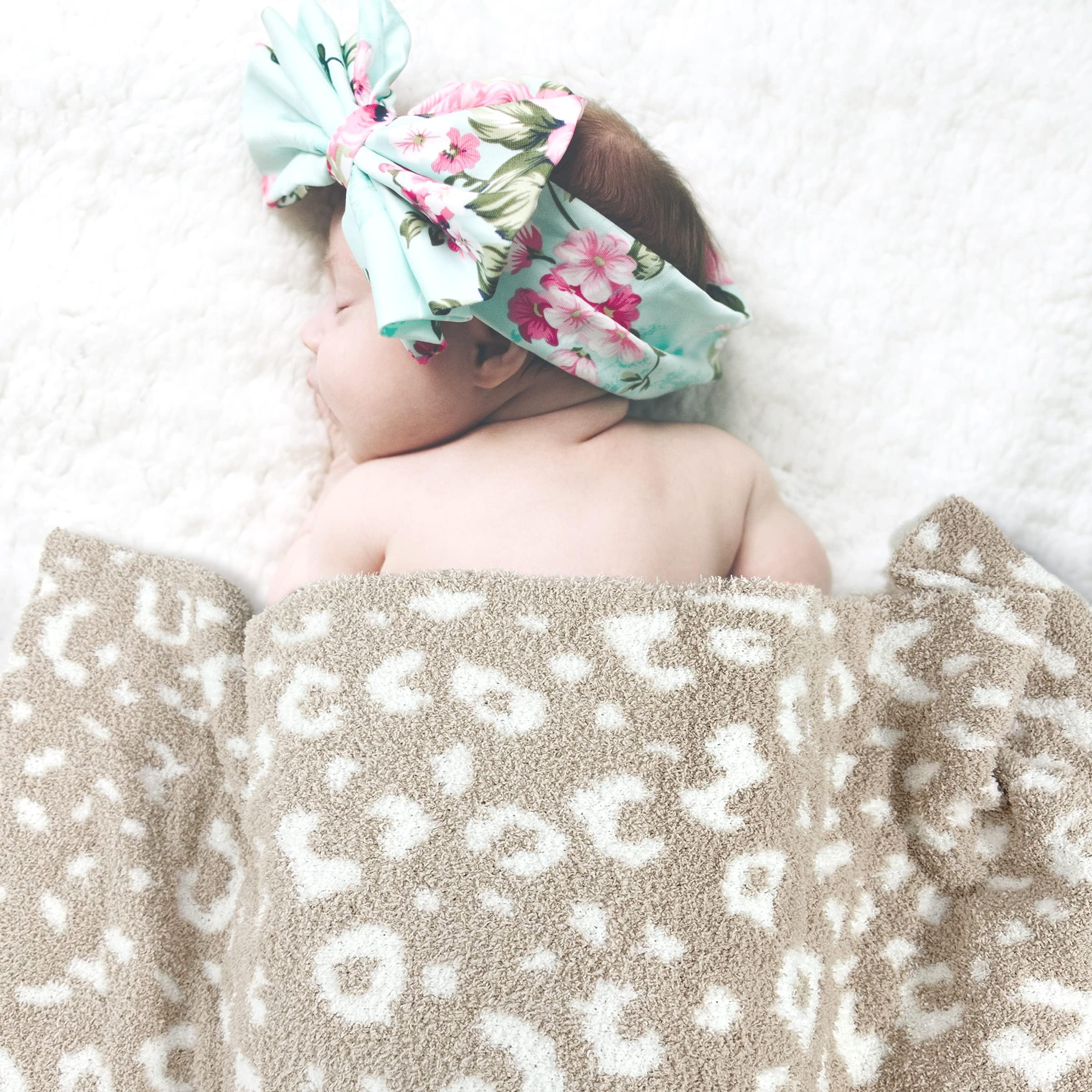JOOJA beige cheetah knit blanket showing versatile textile design for nursery decor.