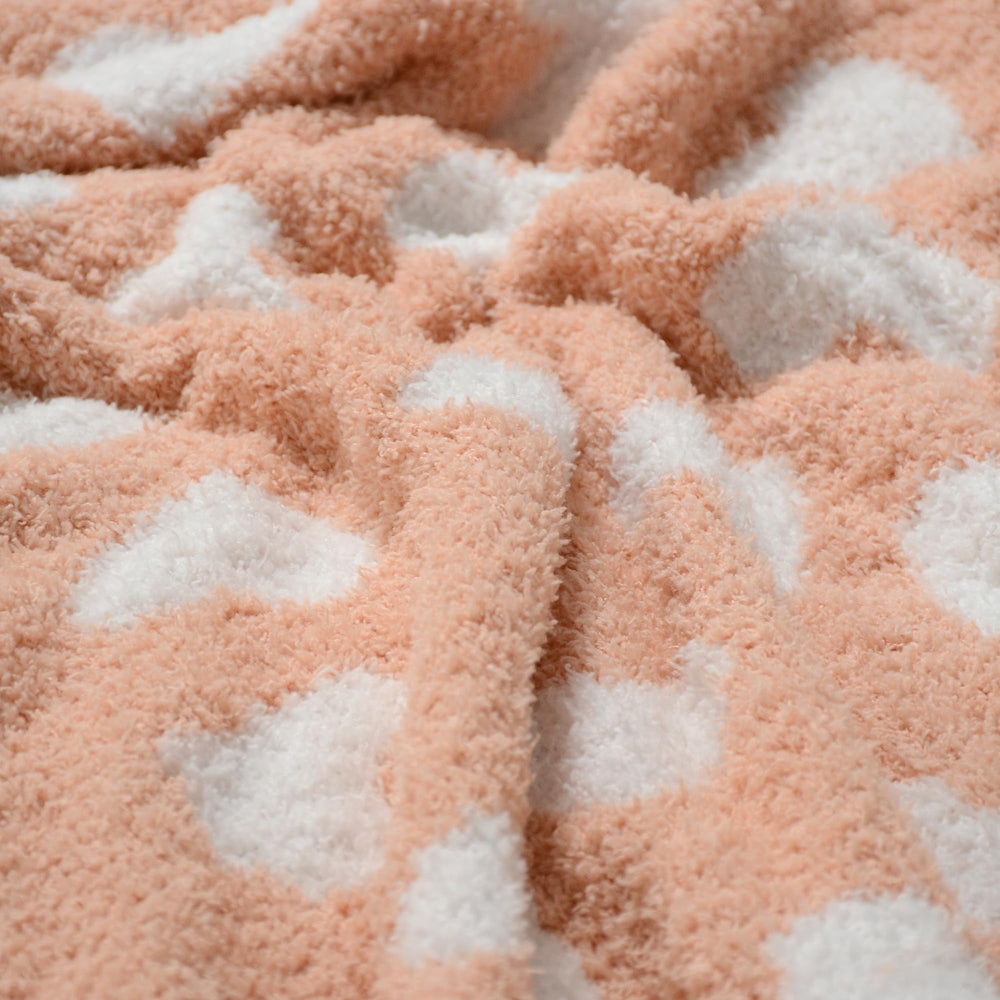 JOOJA coral pink gift-ready baby blanket with ribbon wrap for newborn gifting.