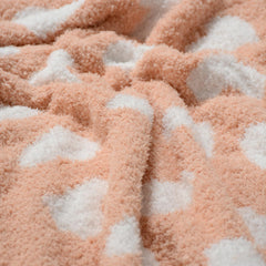 JOOJA coral pink gift-ready baby blanket with ribbon wrap for newborn gifting.