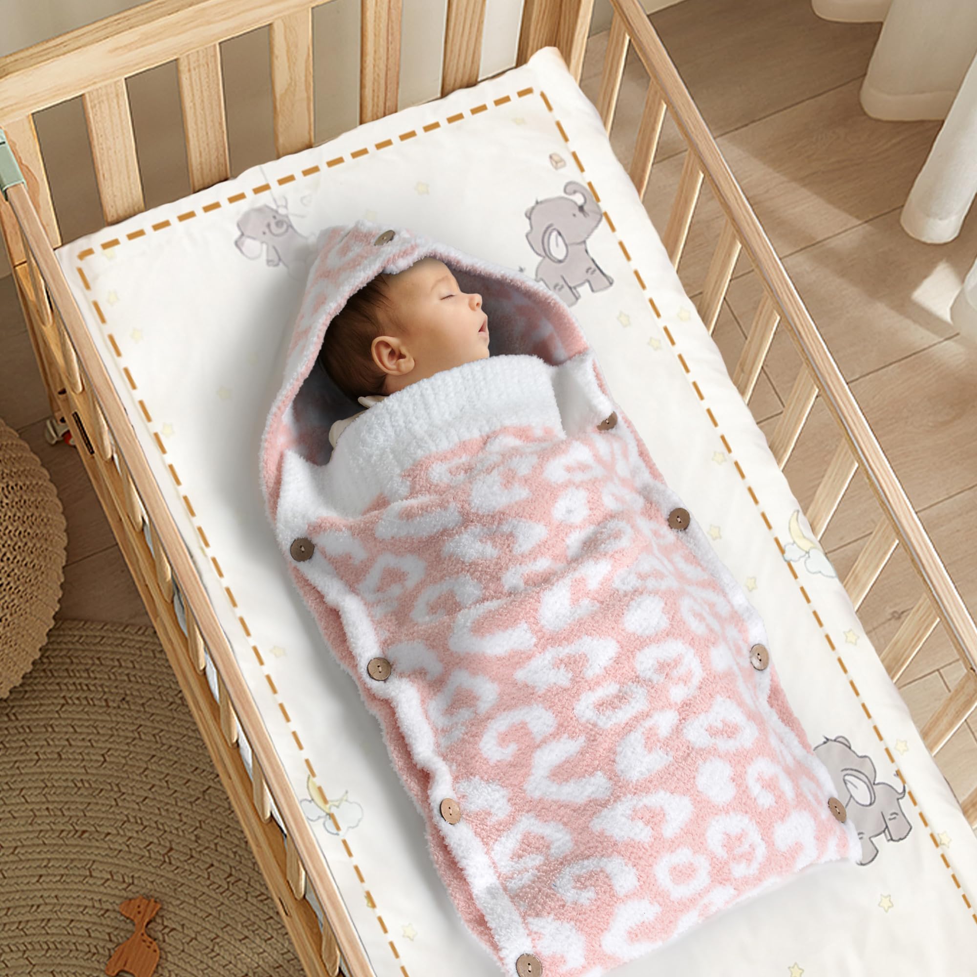 JOOJA hooded baby wrap with adjustable buttons secures swaddle as needed.