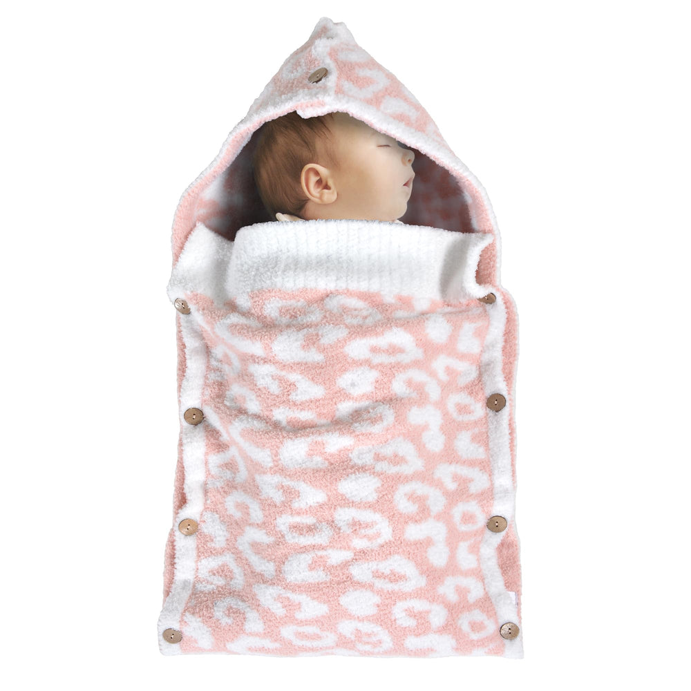 JOOJA newborn swaddle with ultra-soft yarn delivers gentle warmth for baby.