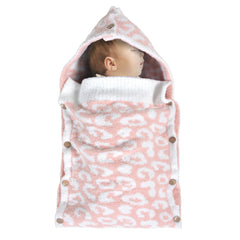 JOOJA newborn swaddle with ultra-soft yarn delivers gentle warmth for baby.