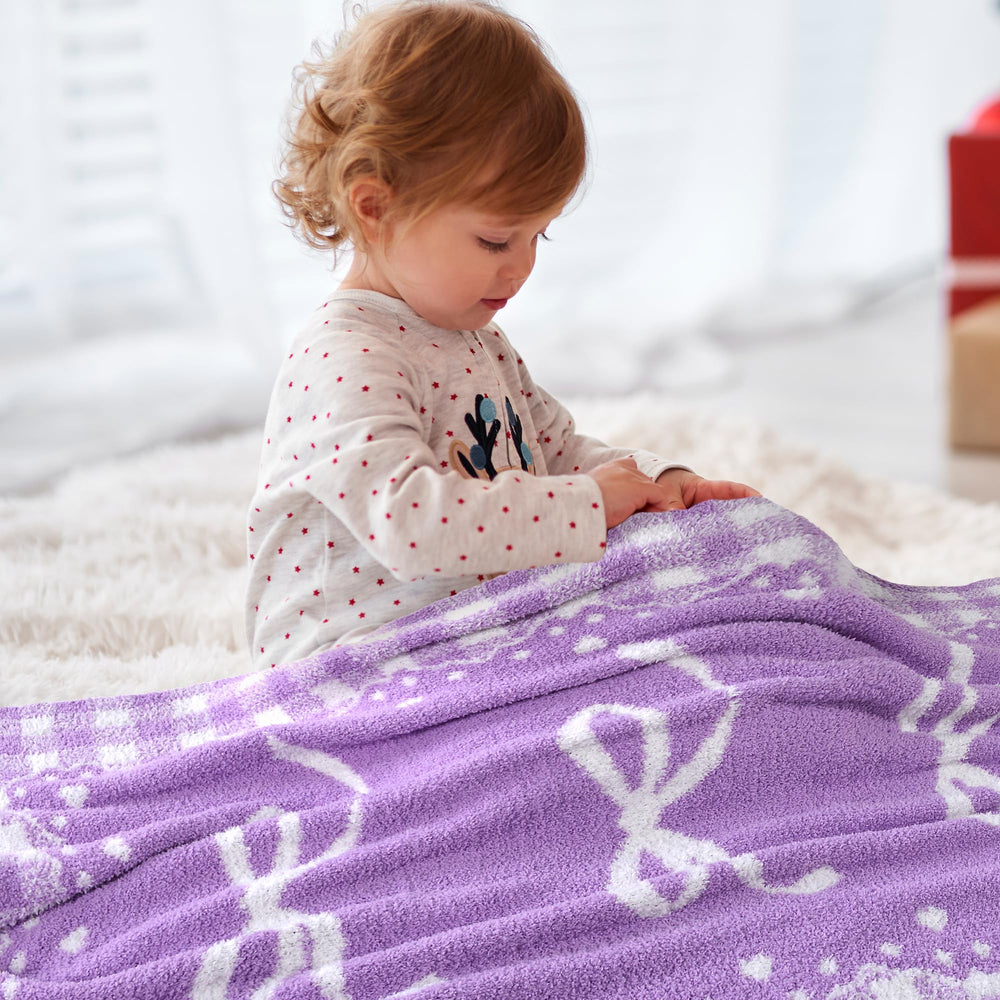 JOOJA Purple Bow Blanket folded neatly, demonstrating portable, gift-ready design.