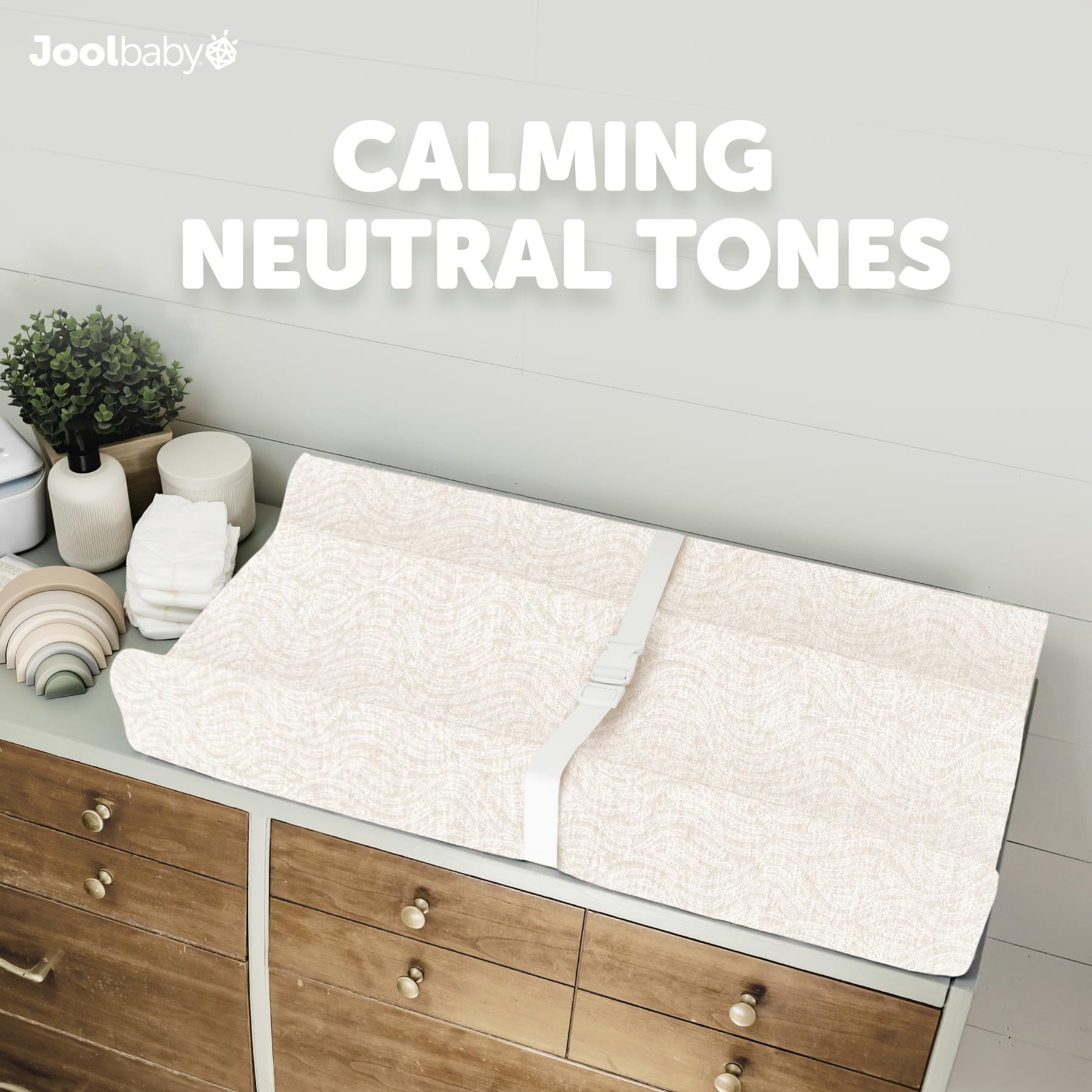 Jool Baby changing pad cover machine washable for easy mess cleanup.
