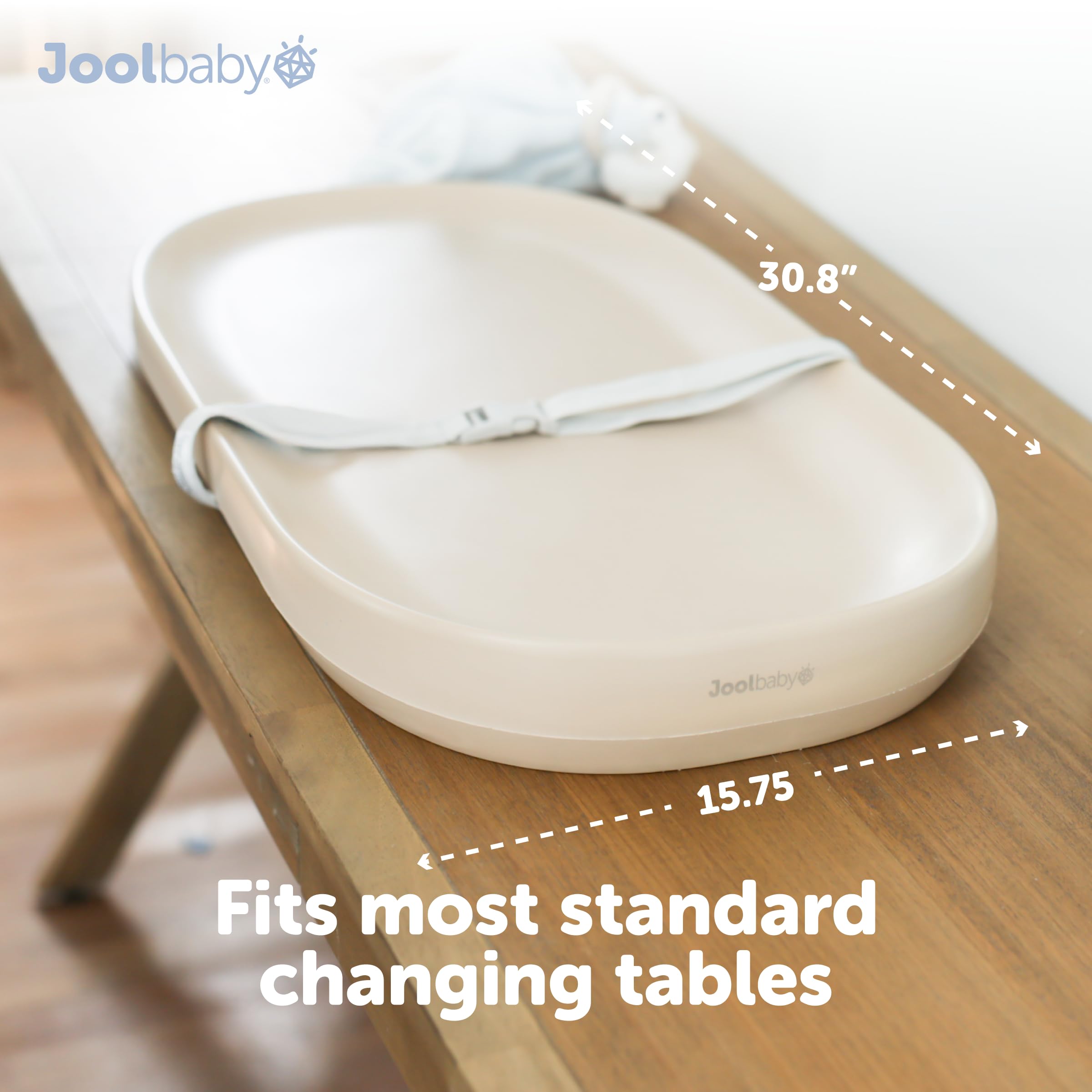 Jool Baby changing pad with safety strap keeping baby secure during changes