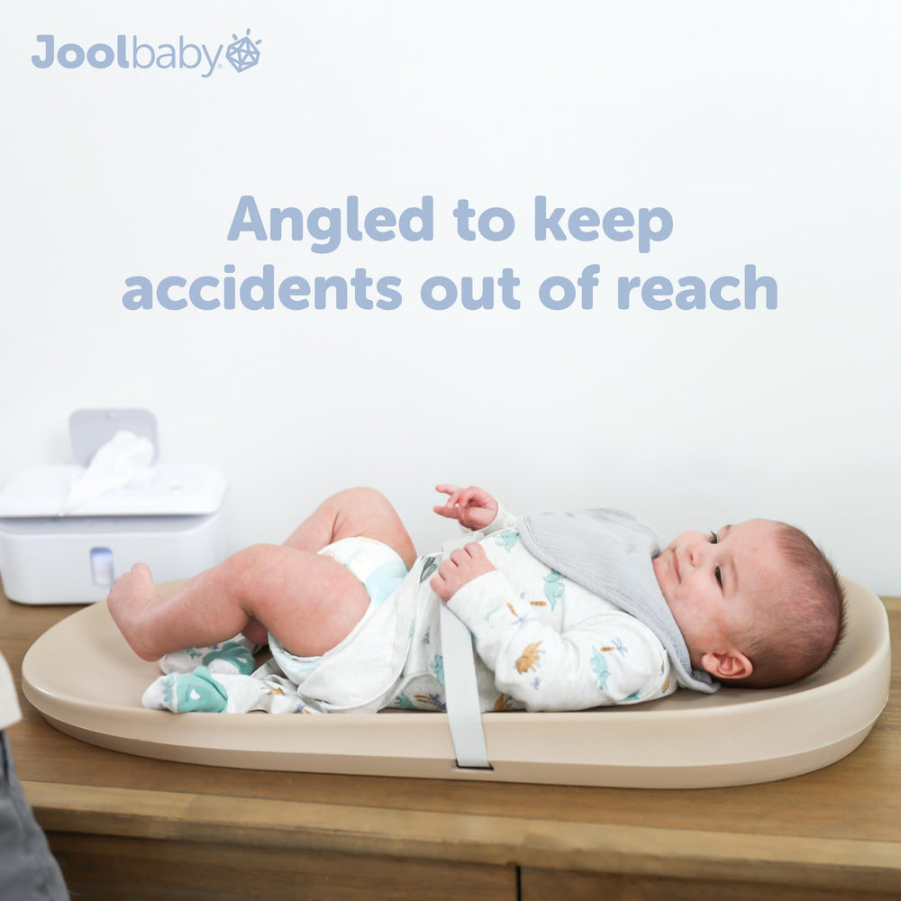 Jool Baby slanted design helps manage messes during diaper changes