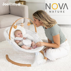 Jool Baby Nova Nature Swing oak wood toy bar adds natural charm.