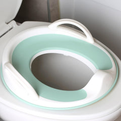 Jool Baby potty seat handles provide a secure grip for toddlers.