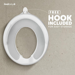 Jool Baby potty seat splash guard helps contain messes during use.