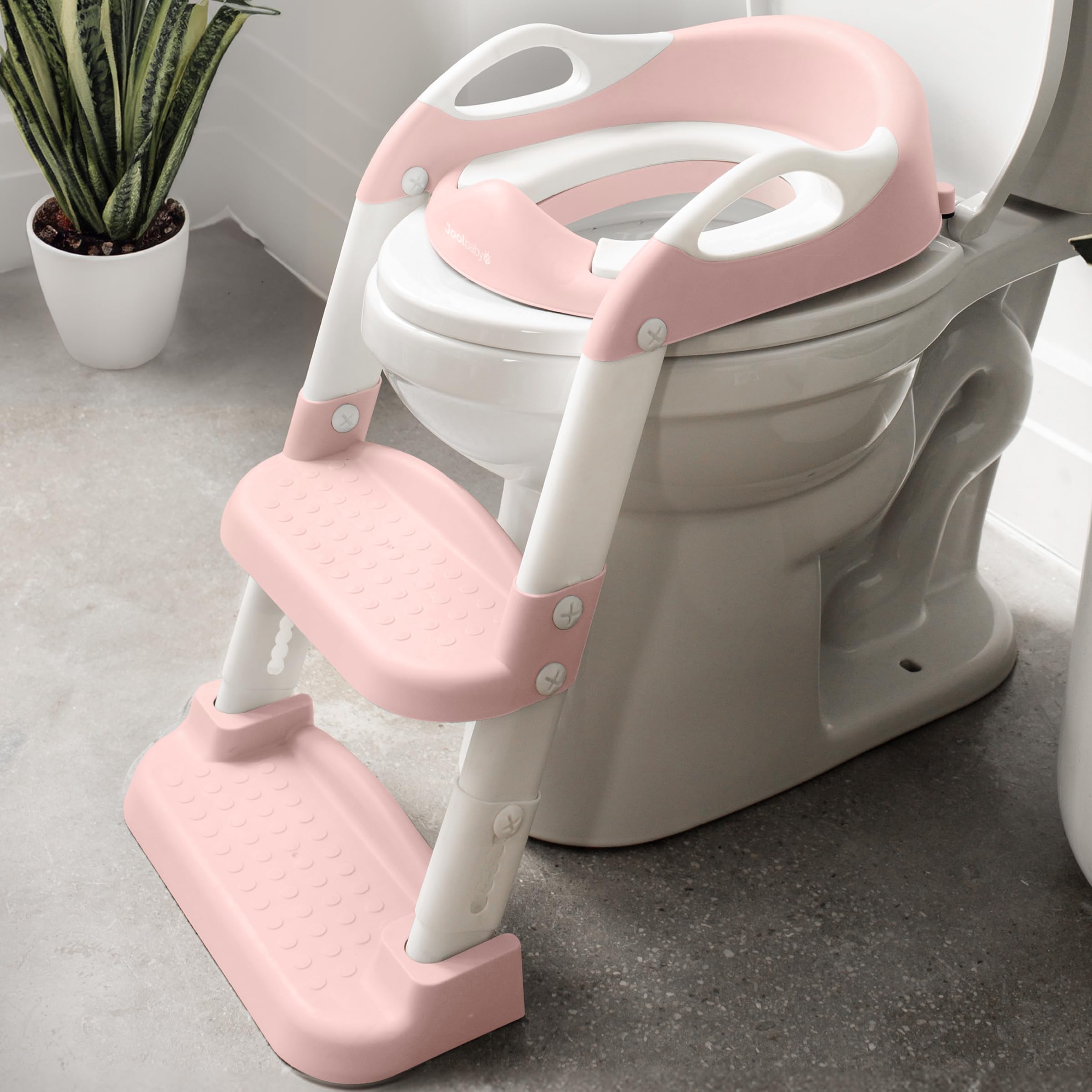 Jool Baby potty training seat with pink two-step ladder supports independent toilet use.