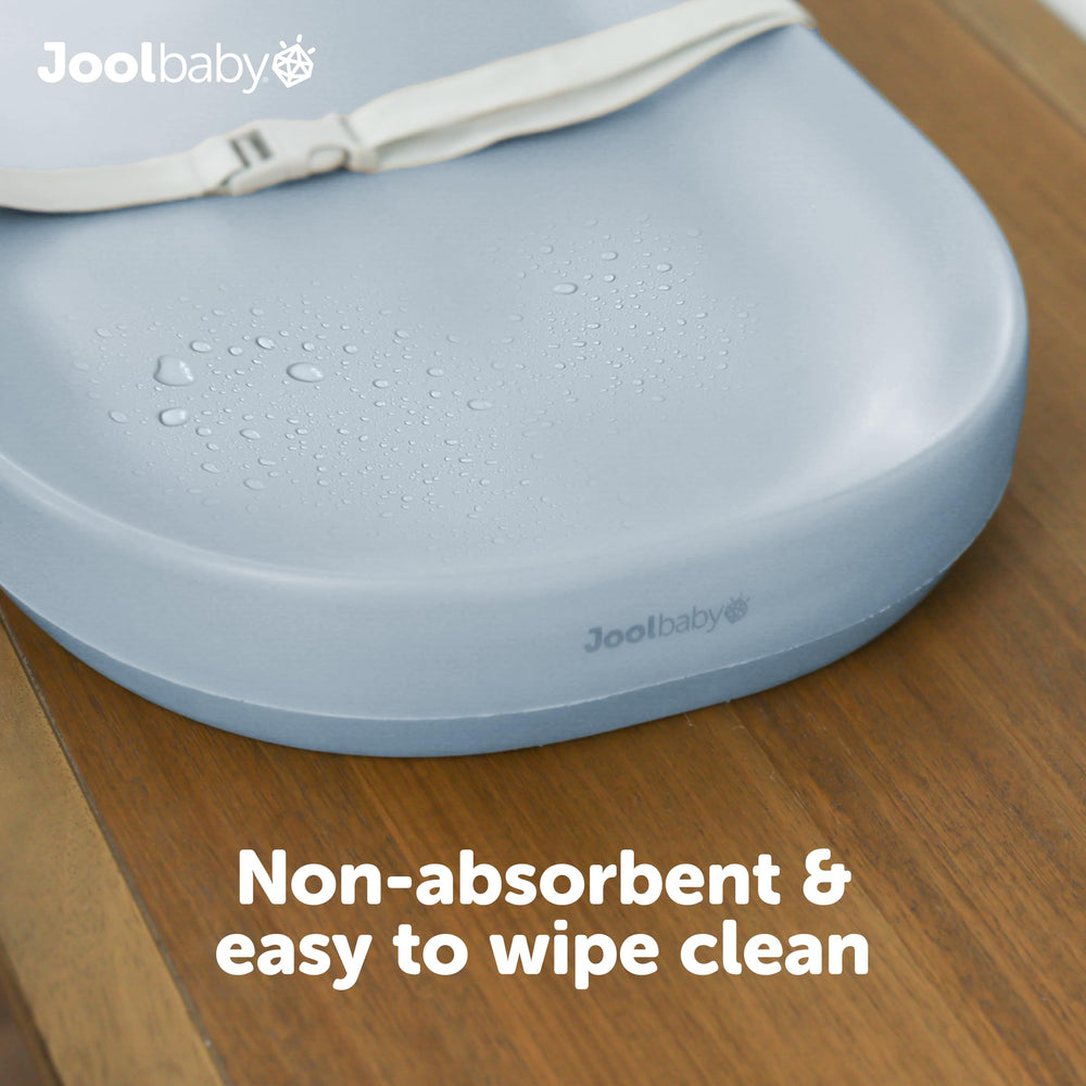 Jool Baby raised sides and safety strap keep baby secure during changes.