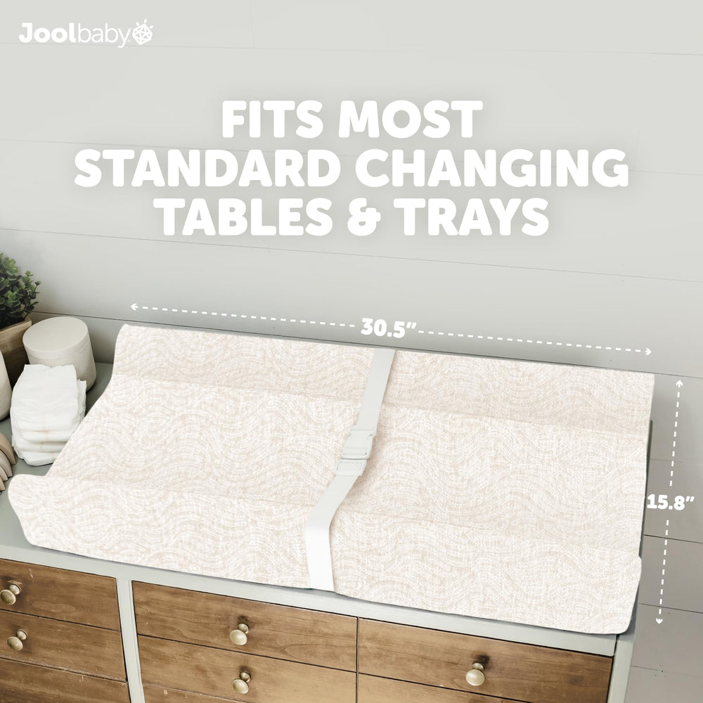 Jool Baby Serenity changing pad fits standard tables and dressers.