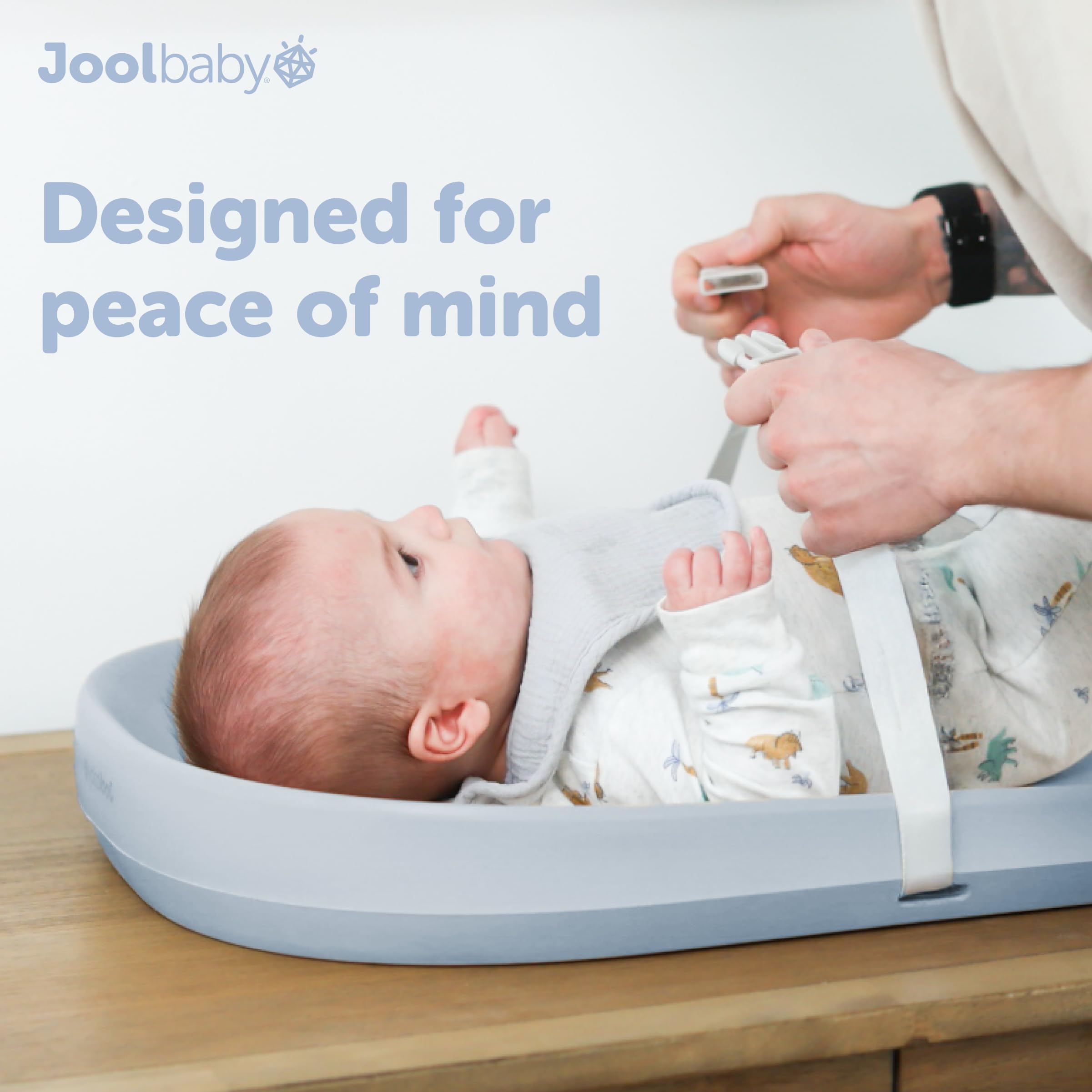 Jool Baby blue pad adds sleek nursery style and calm ambiance.